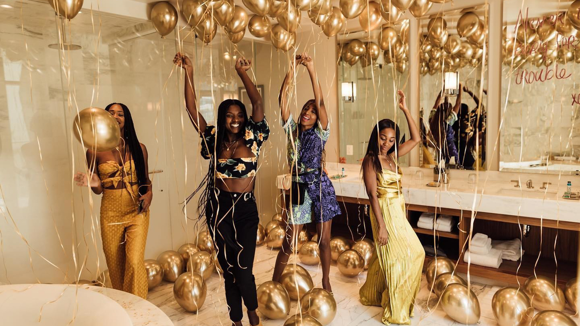 bachelorette party girls with gold balloons